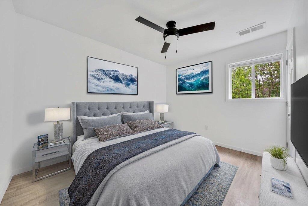 5247 West 3rd Avenue Gary, IN 46406 - Photo 9 of 16 a bedroom with bed and a painting on the wall