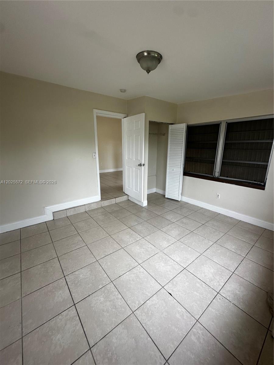 14475 Southwest 288th Street Homestead, FL 33033 - Photo 3 of 26 a view of an empty room and window