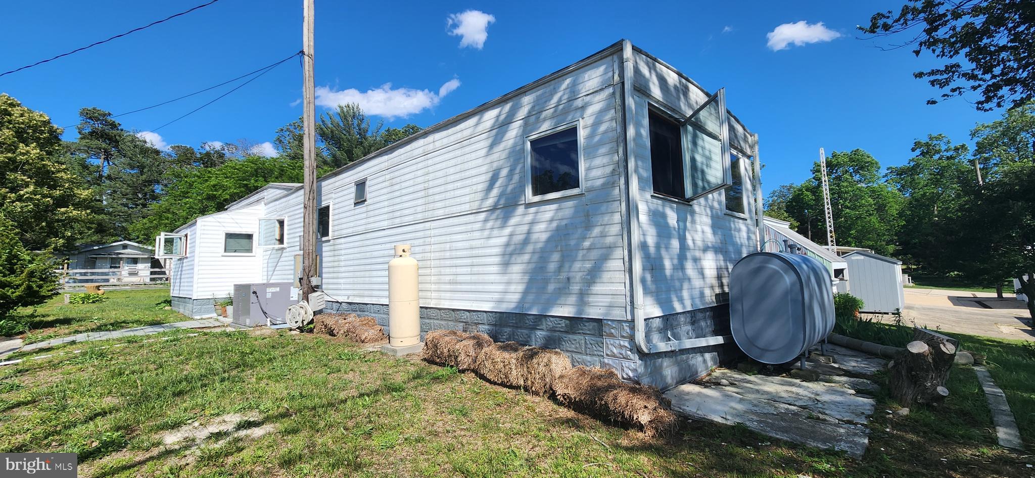 28050 Possum Point Road Millsboro, DE 19966 - Photo 11 of 47 a view of a house with backyard and garden