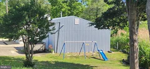 a view of a couches in backyard of the house