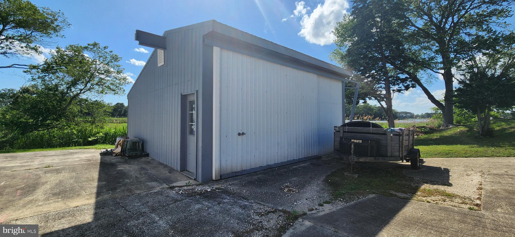 28050 Possum Point Road Millsboro, DE 19966 - Photo 14 of 47 a view of a couches in backyard of the house