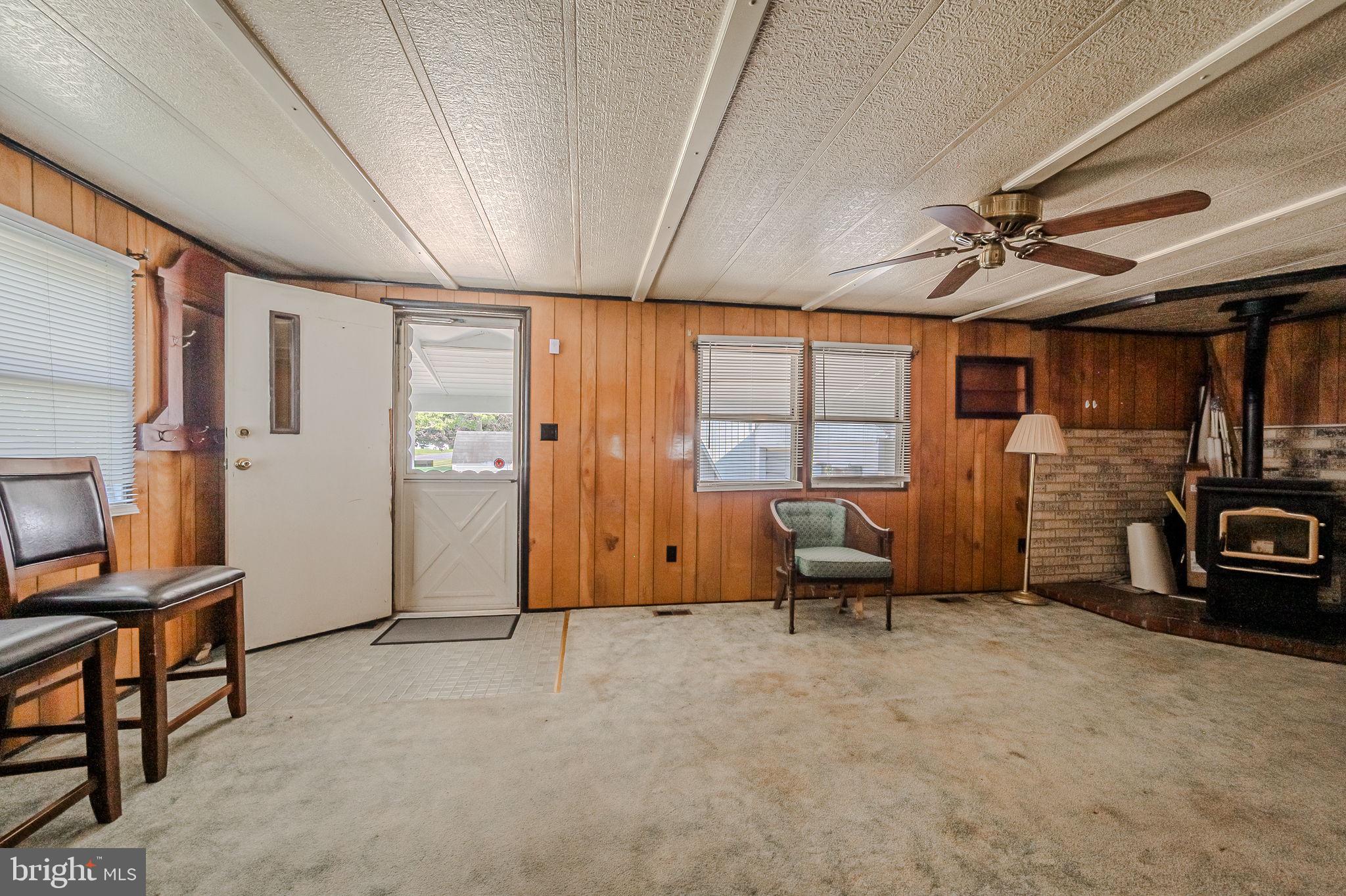 28050 Possum Point Road Millsboro, DE 19966 - Photo 22 of 47 a view of a livingroom with furniture and a window