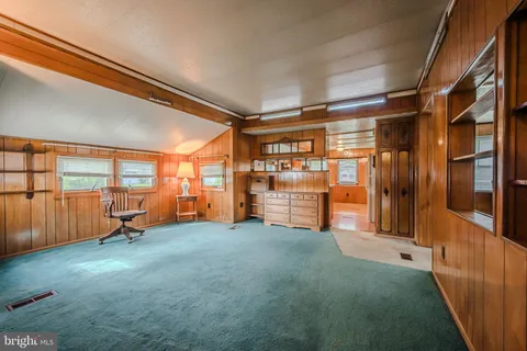 a view of a kitchen with a large window