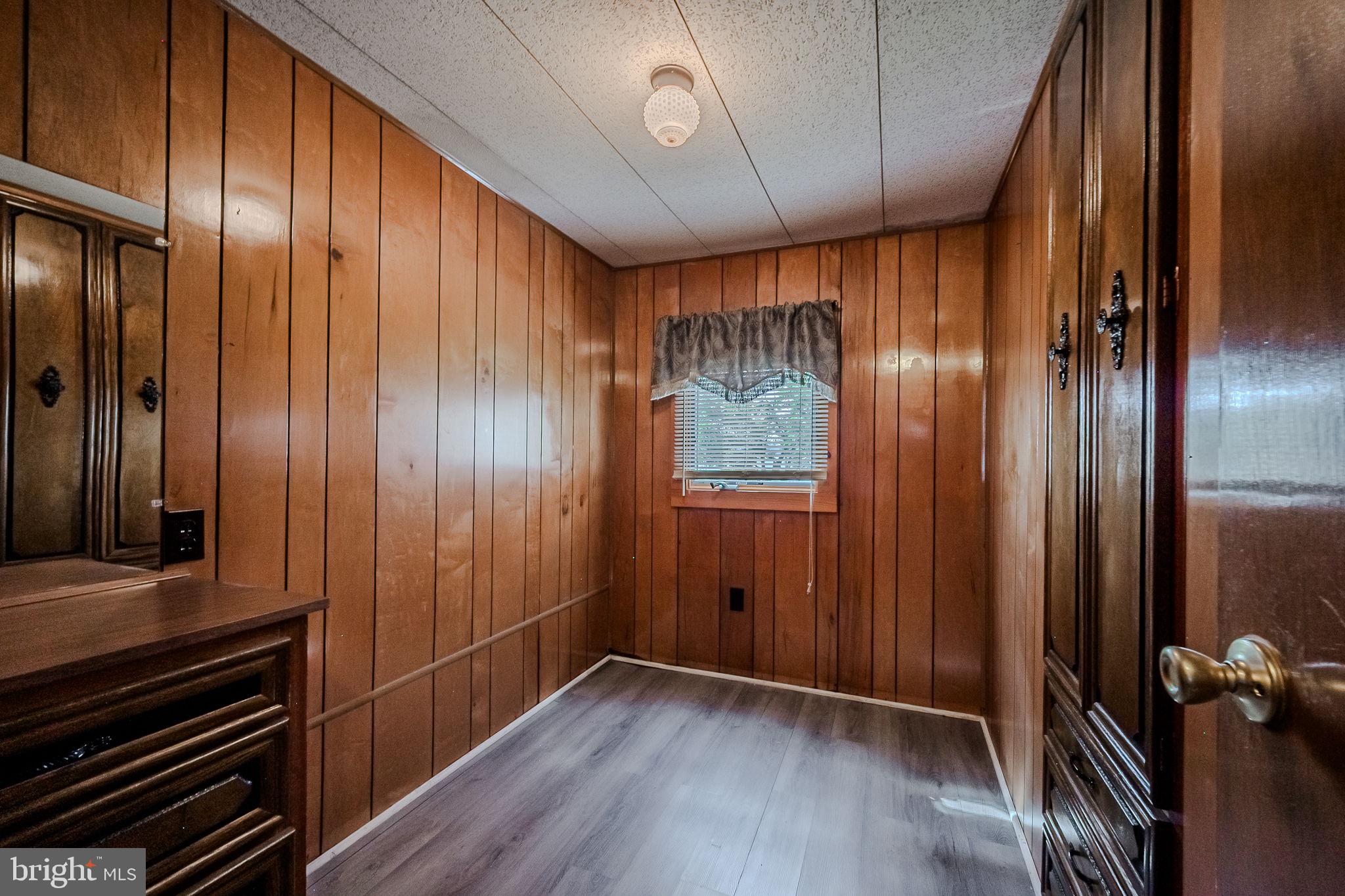 28050 Possum Point Road Millsboro, DE 19966 - Photo 37 of 47 a view of a room with wooden walls