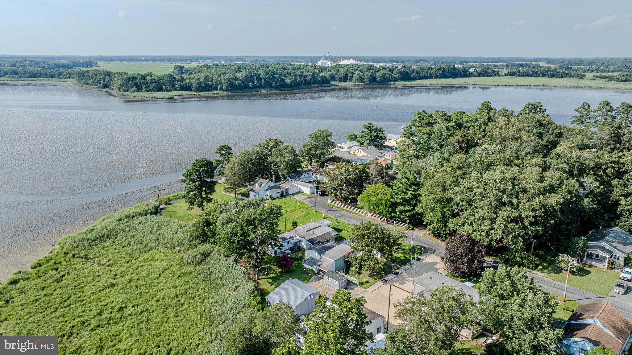 28050 Possum Point Road Millsboro, DE 19966 - Photo 43 of 47 a view of a lake with a city view