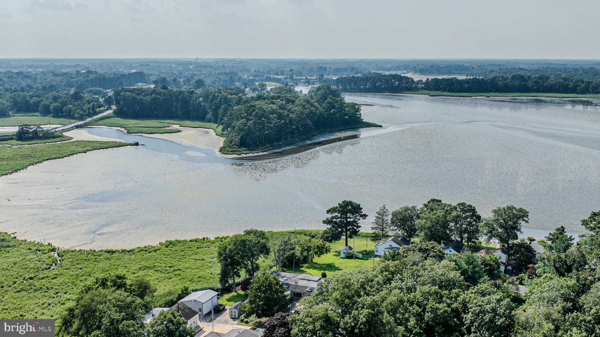 28050 Possum Point Road Millsboro, DE 19966 - Photo 45 of 47 an aerial view of a house with a yard and lake view