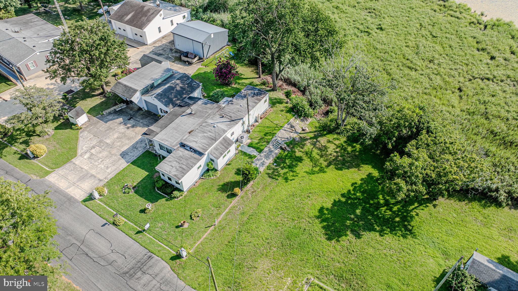 28050 Possum Point Road Millsboro, DE 19966 - Photo 46 of 47 an aerial view of residential houses with outdoor space
