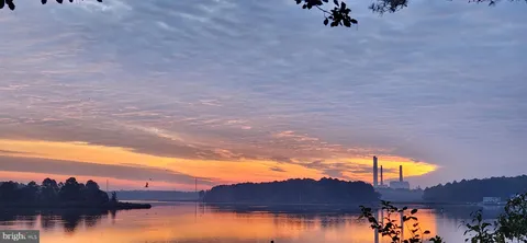 a view of a lake in middle of a town