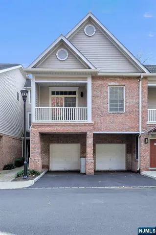 a front view of a house with a garage