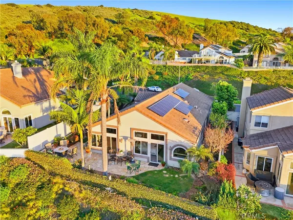 a living room with furniture ceiling fan and a rug
