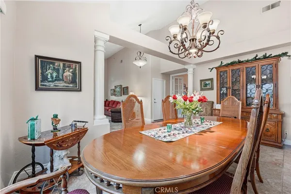 a bathroom with a granite countertop sink a mirror and bathtub