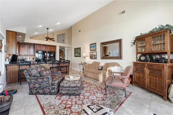 a bedroom with a bed and a lamp on the table