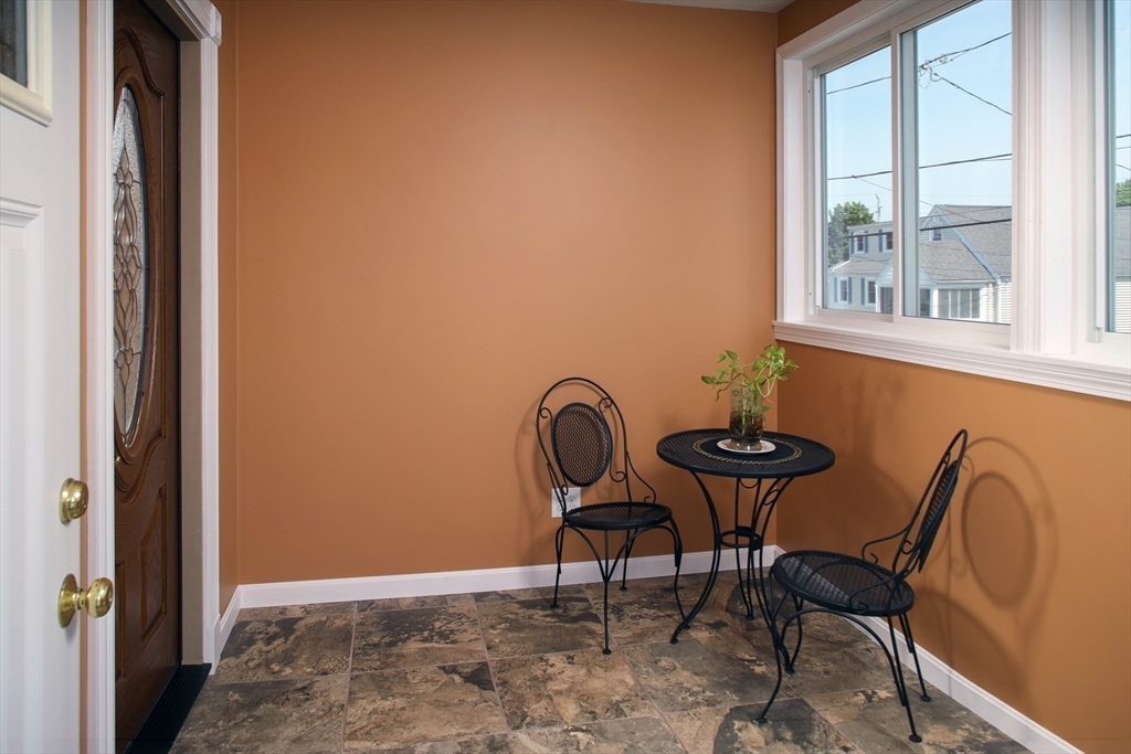 67 Newport Road Hull, MA 02045 - Photo 3 of 26 a view of a chair and table in the balcony