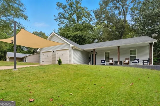 a view of a house with swimming pool and porch