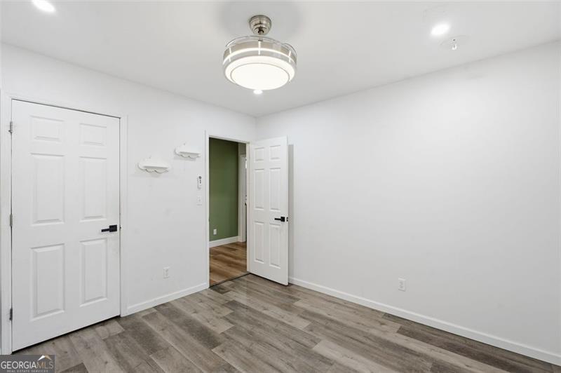 4450 Dorsett Shoals Road Douglasville, GA 30135 - Photo 31 of 36 wooden floor in an empty room