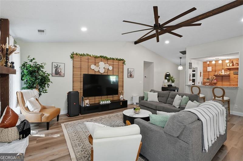 4450 Dorsett Shoals Road Douglasville, GA 30135 - Photo 7 of 36 a living room with furniture and a flat screen tv