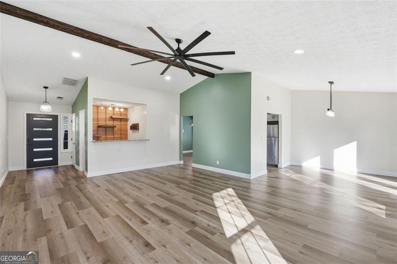 4450 Dorsett Shoals Road Douglasville, GA 30135 - Photo 8 of 36 a view of empty room with wooden floor and window
