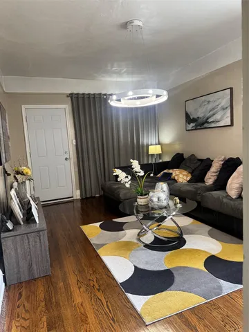 a bathroom with a toilet a sink and shower curtain