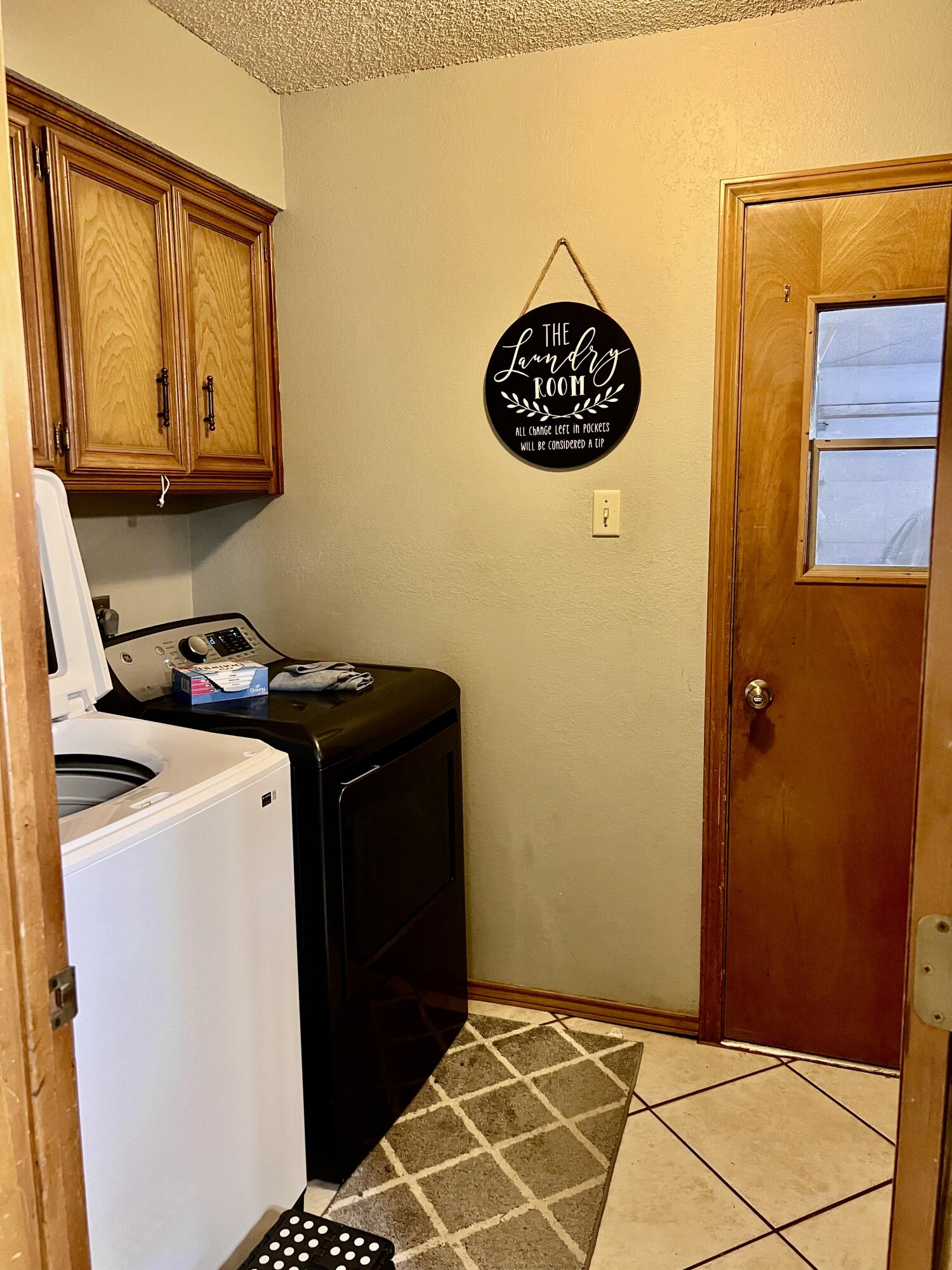 5725 63rd Street Lubbock, TX 79424 - Photo 12 of 14 a view of storage and utility room with fridge