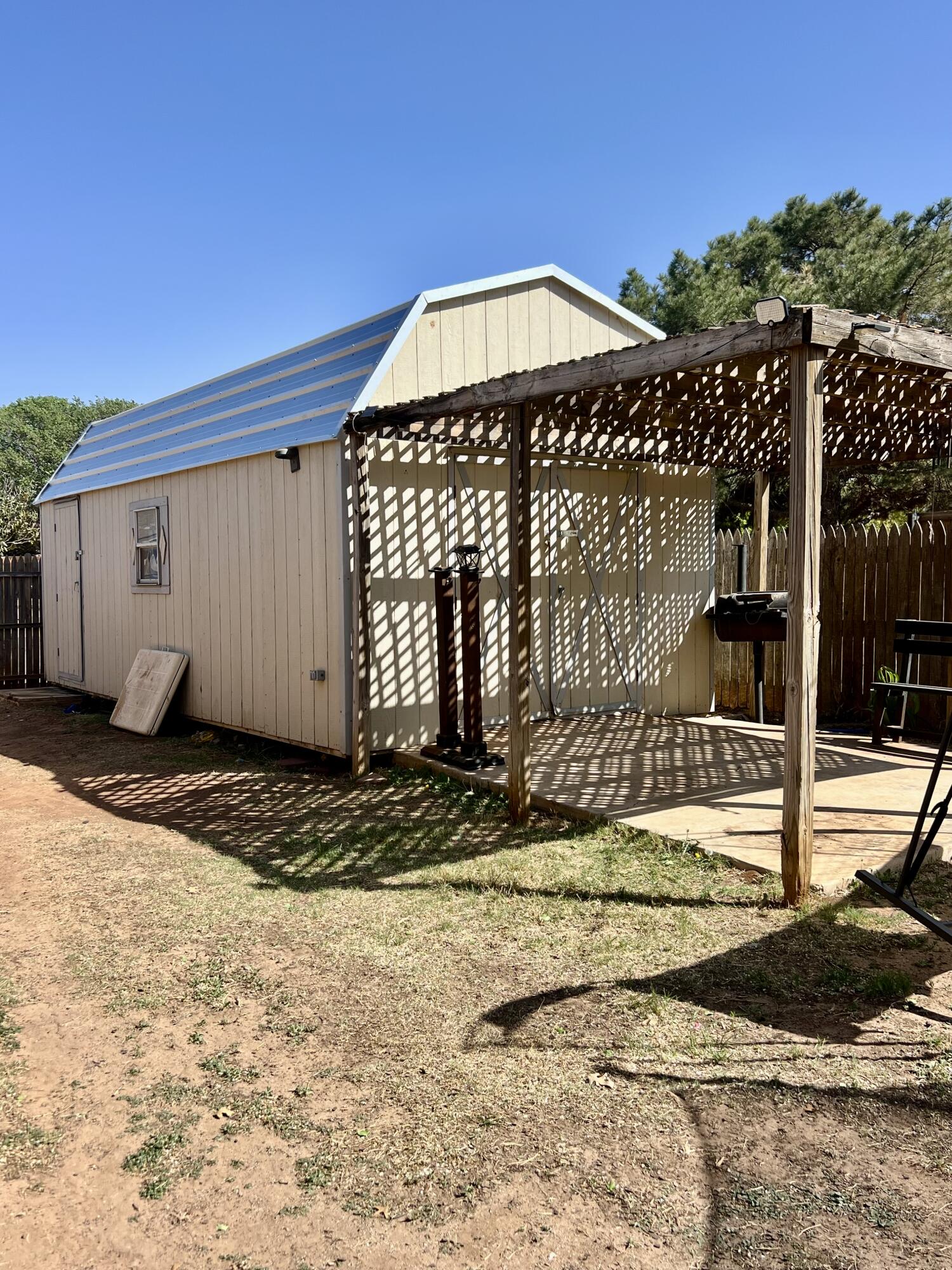 5725 63rd Street Lubbock, TX 79424 - Photo 13 of 14 a front view of a house with garden