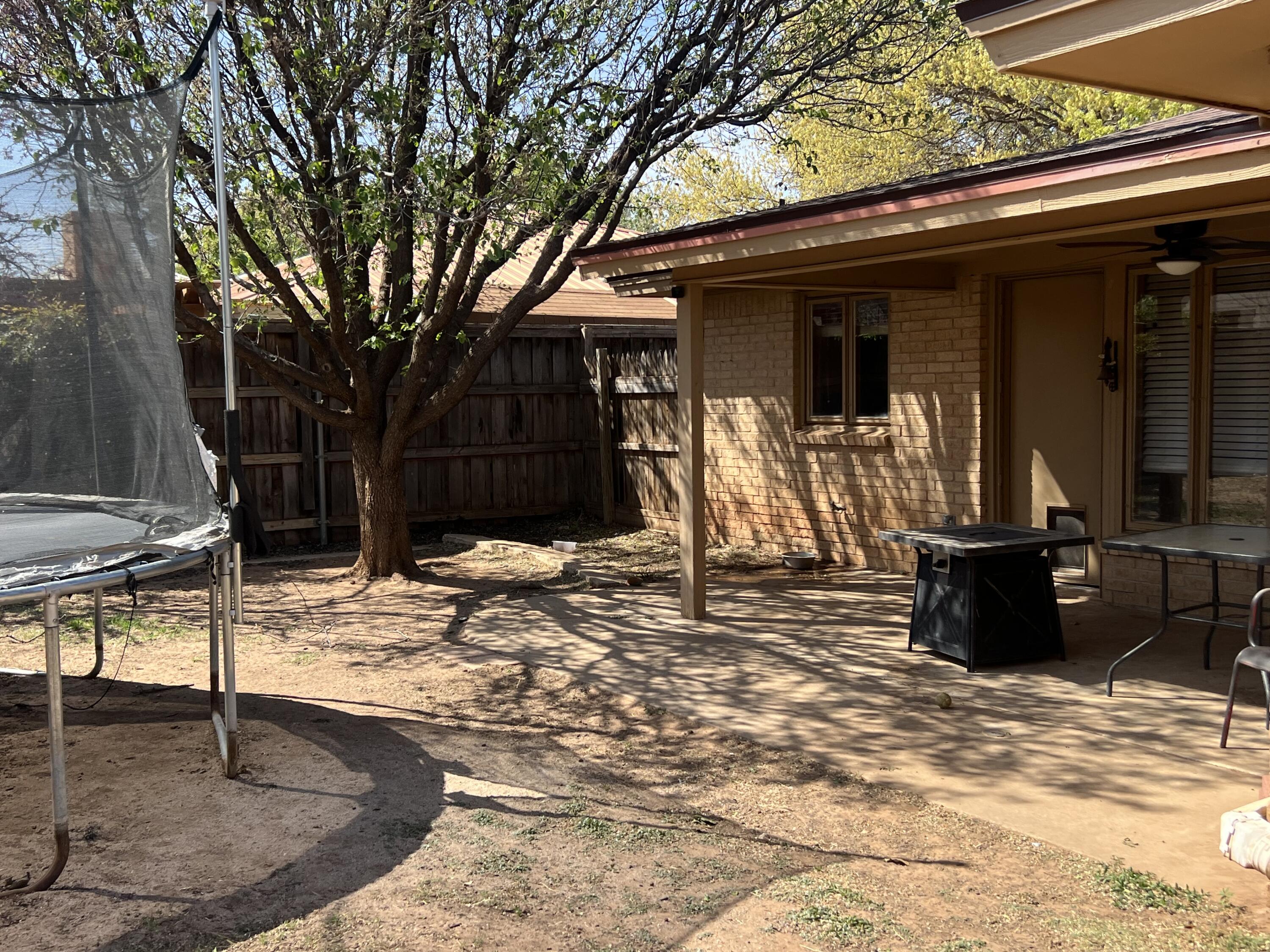 5725 63rd Street Lubbock, TX 79424 - Photo 14 of 14 a view of a house with a snow in the yard