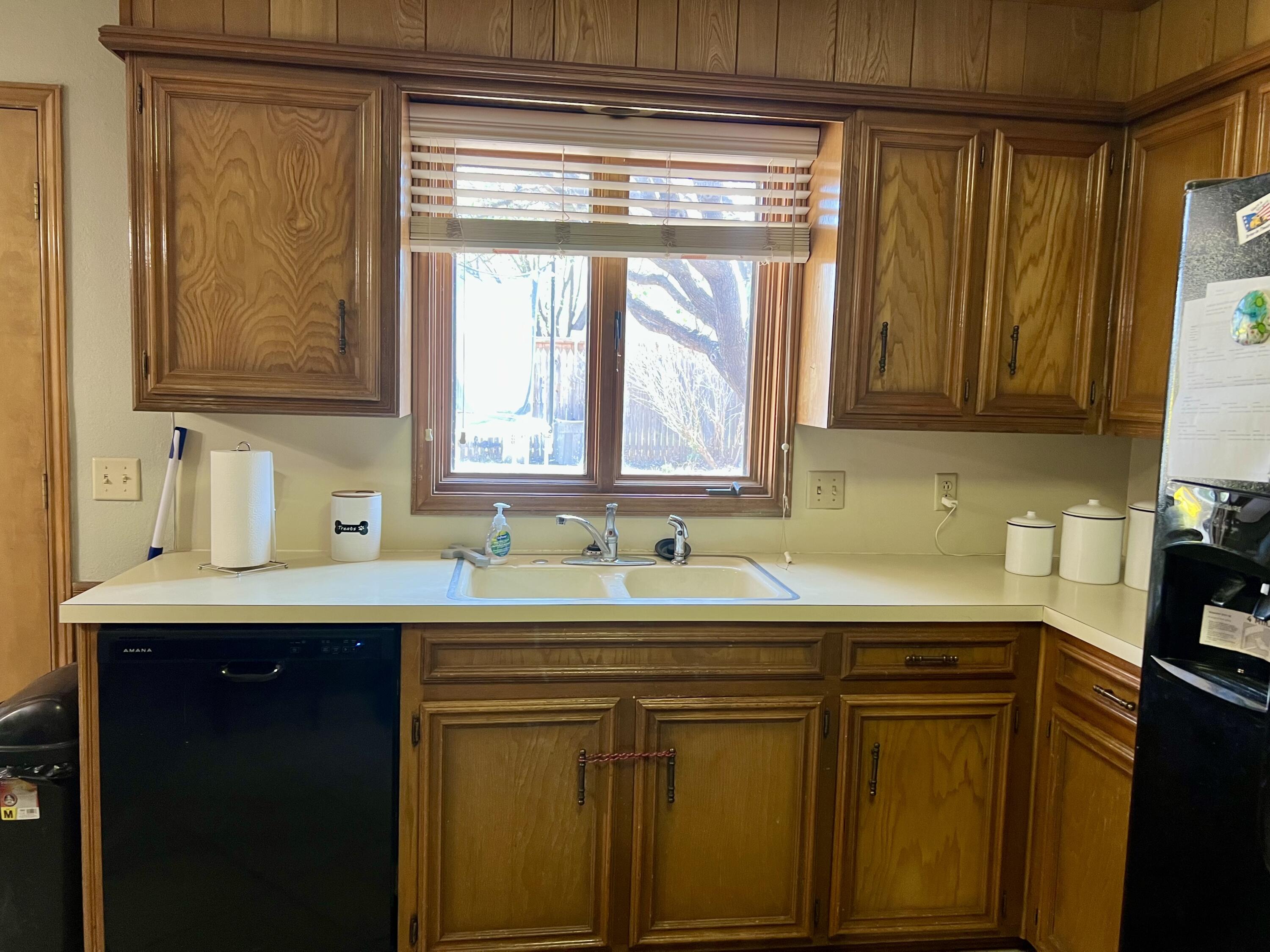 5725 63rd Street Lubbock, TX 79424 - Photo 6 of 14 a kitchen with stainless steel appliances a sink and cabinets