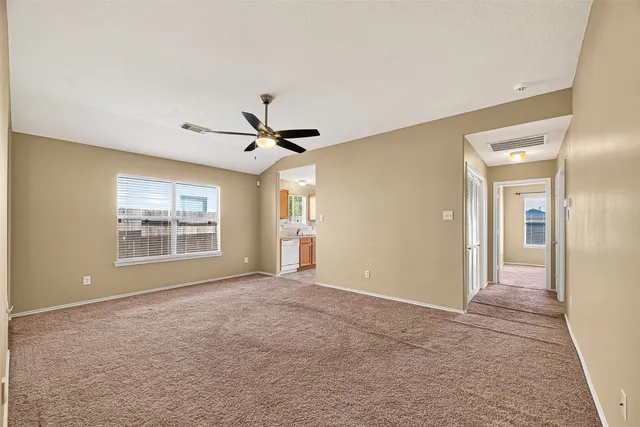 a view of an empty room with a window