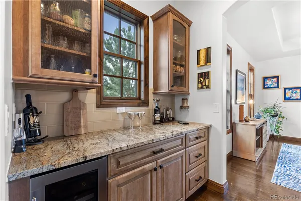 a kitchen with granite countertop a sink and a window