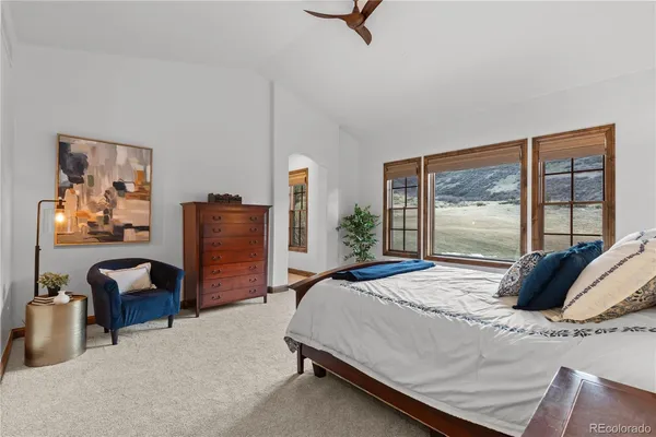 a bedroom with furniture and a window