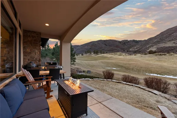 a terrace of a house with outdoor seating