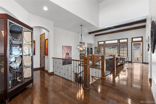 a view of a livingroom with furniture and hardwood floor