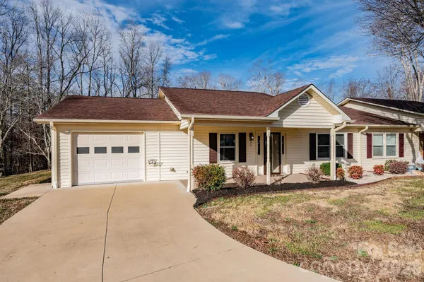 a front view of a house with sitting space and garden