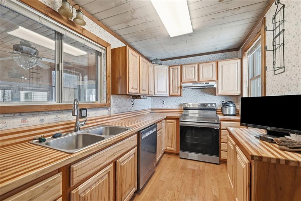 7524 Franklin Road Cranberry Township, PA 16066 - Photo 13 of 44 a kitchen with stainless steel appliances granite countertop a sink stove and cabinets