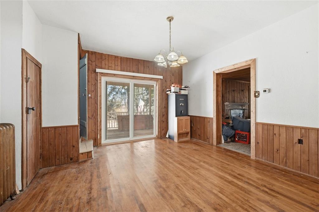 7524 Franklin Road Cranberry Township, PA 16066 - Photo 16 of 44 a view of a livingroom with wooden floor and a chandelier