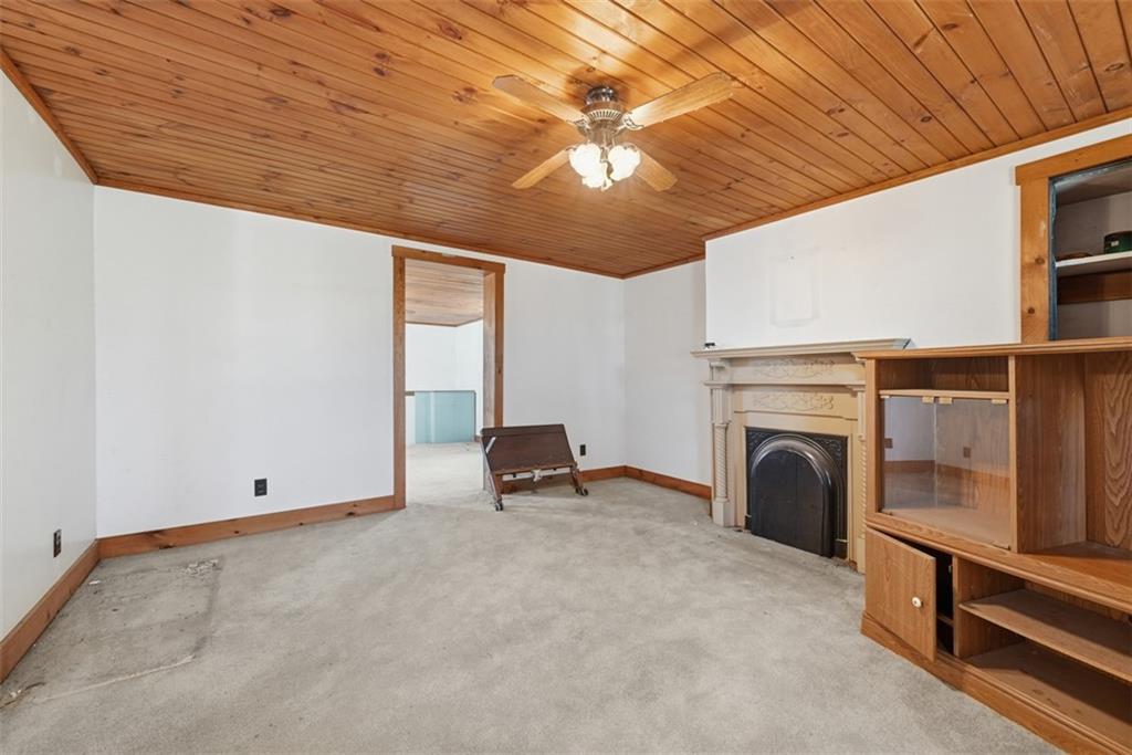 7524 Franklin Road Cranberry Township, PA 16066 - Photo 20 of 44 a room with furniture and a fireplace