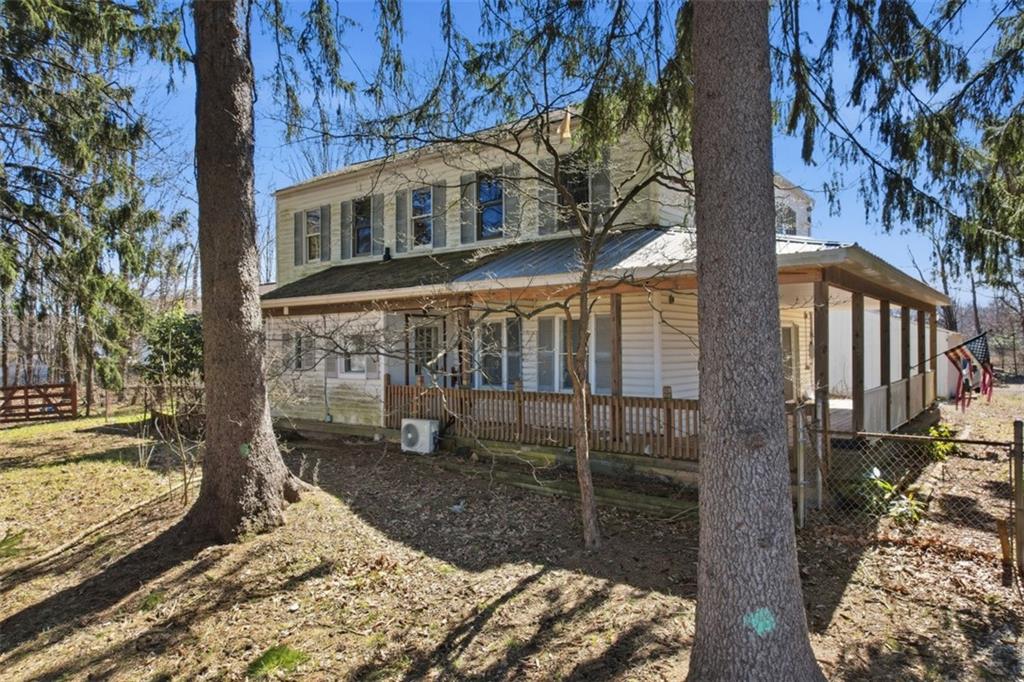 7524 Franklin Road Cranberry Township, PA 16066 - Photo 2 of 44 a view of a house with a yard covered with snow in the background