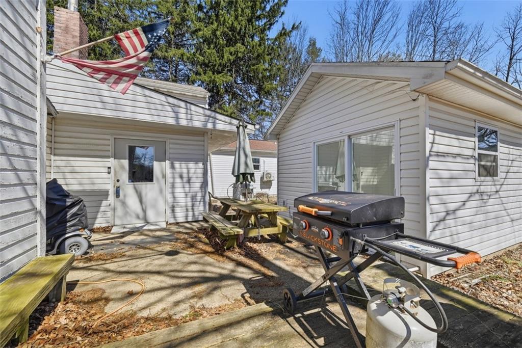 7524 Franklin Road Cranberry Township, PA 16066 - Photo 24 of 44 a view of backyard with a patio and outdoor seating