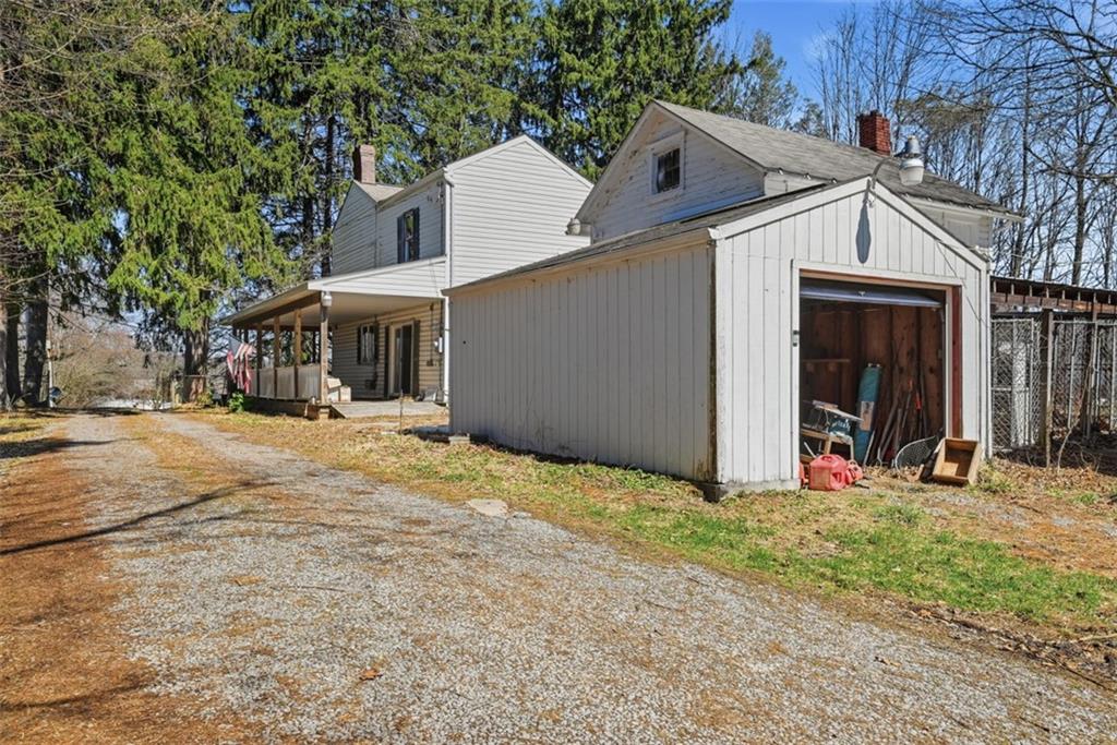 7524 Franklin Road Cranberry Township, PA 16066 - Photo 31 of 44 a view of large white house with large trees and outdoor space