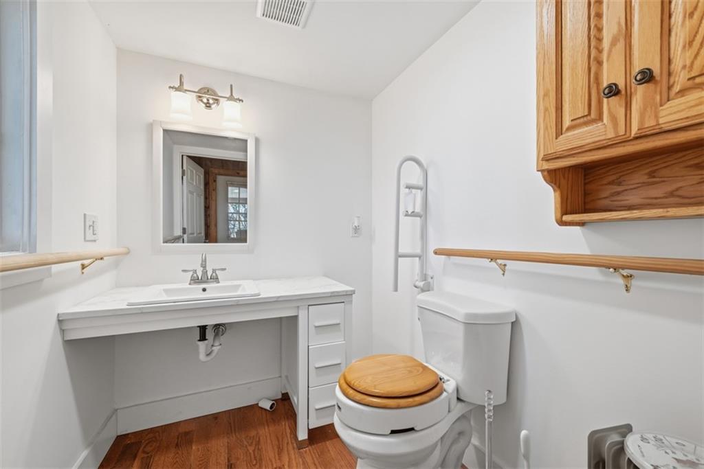 7524 Franklin Road Cranberry Township, PA 16066 - Photo 6 of 44 a bathroom with a sink a toilet and mirror