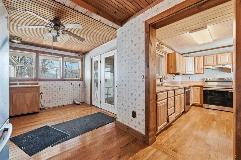 7524 Franklin Road Cranberry Township, PA 16066 - Photo 10 of 44 a kitchen with stainless steel appliances granite countertop a stove a sink and a refrigerator