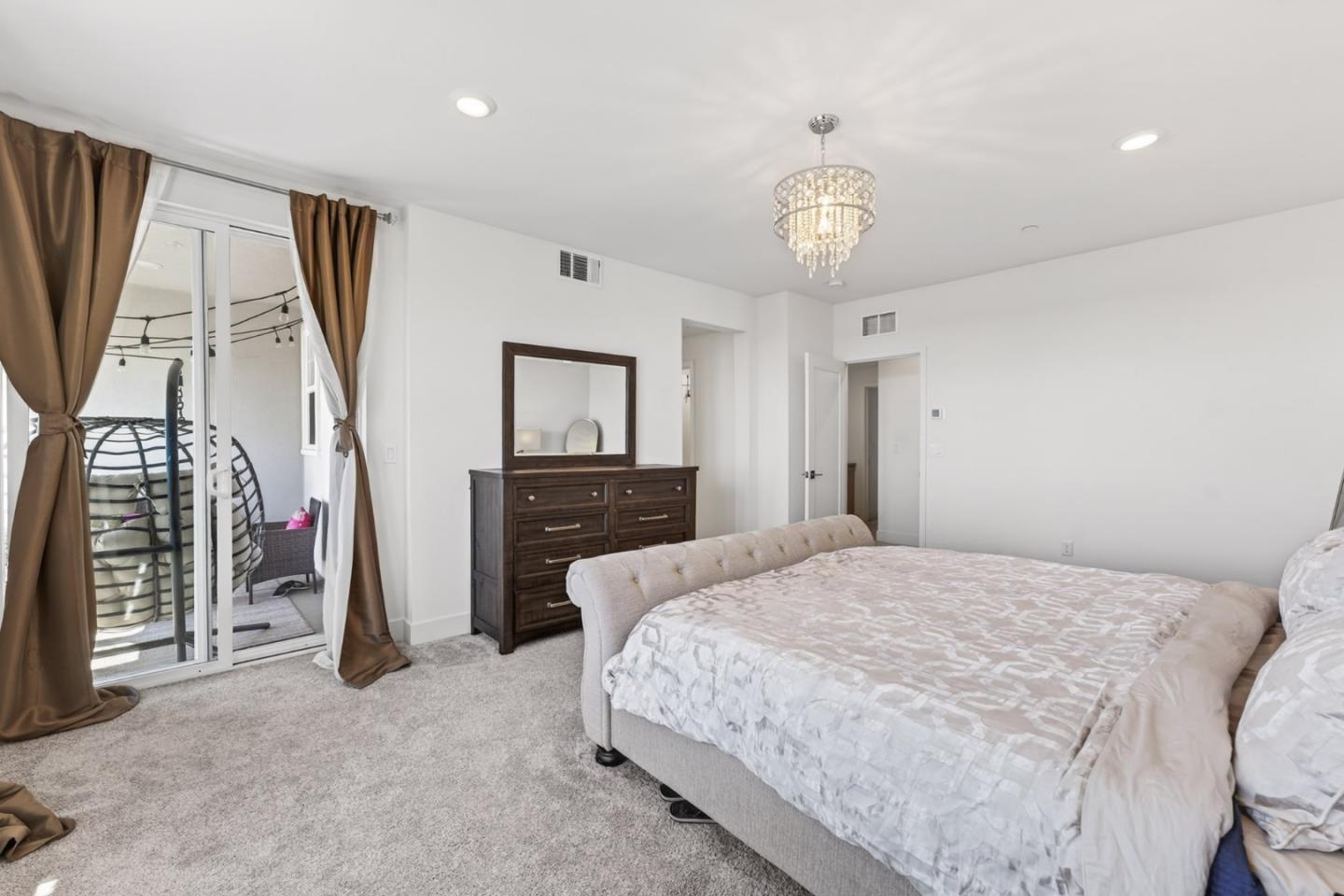 9532 Seawind Way Newark, CA 94560 - Photo 23 of 44 a bedroom with a bed and a tv on the dresser