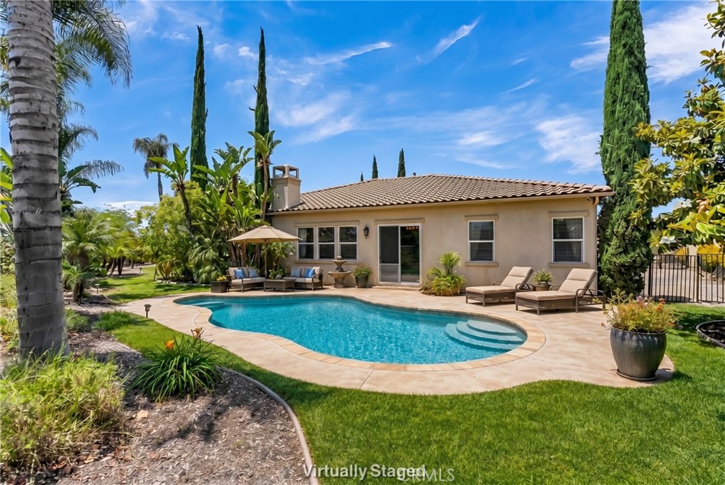 7780 Solitude Court Riverside, CA 92506 - Photo 48 of 71 a view of a house with swimming pool and sitting area