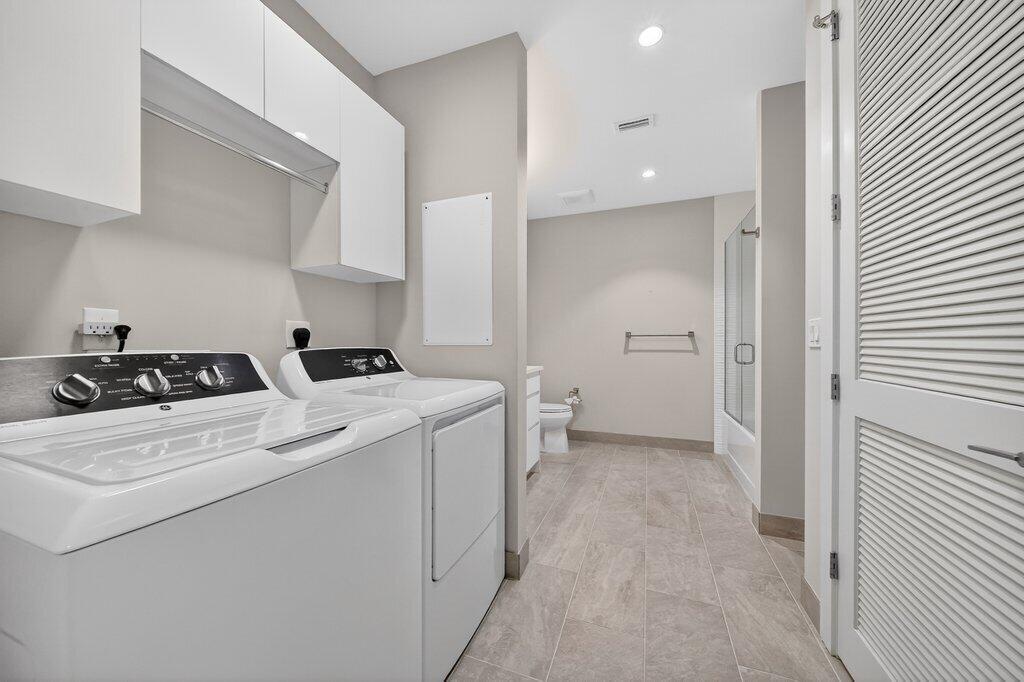 41 Southwest Seminole Street, Unit 209 Stuart, FL 34994 - Photo 8 of 26 a view of storage utility room and utility room