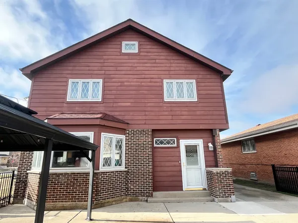 a front view of a house with a garage