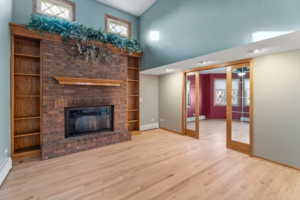 a living room with furniture pool table and a large window