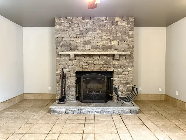 a living room with a fireplace