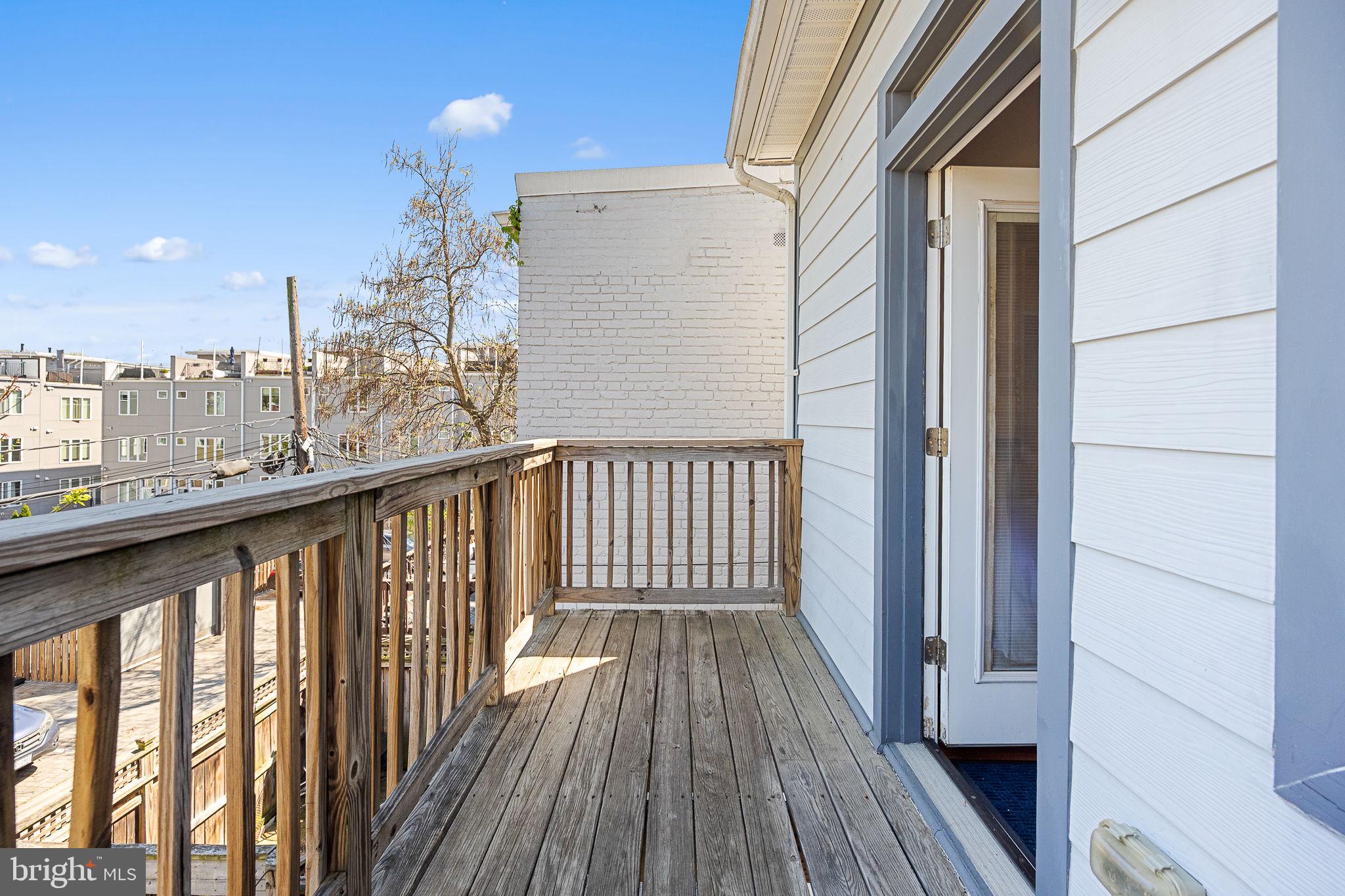2819 11th Street Northwest, Unit 2 Washington, DC 20001 - Photo 20 of 36 a view of a balcony with wooden floor