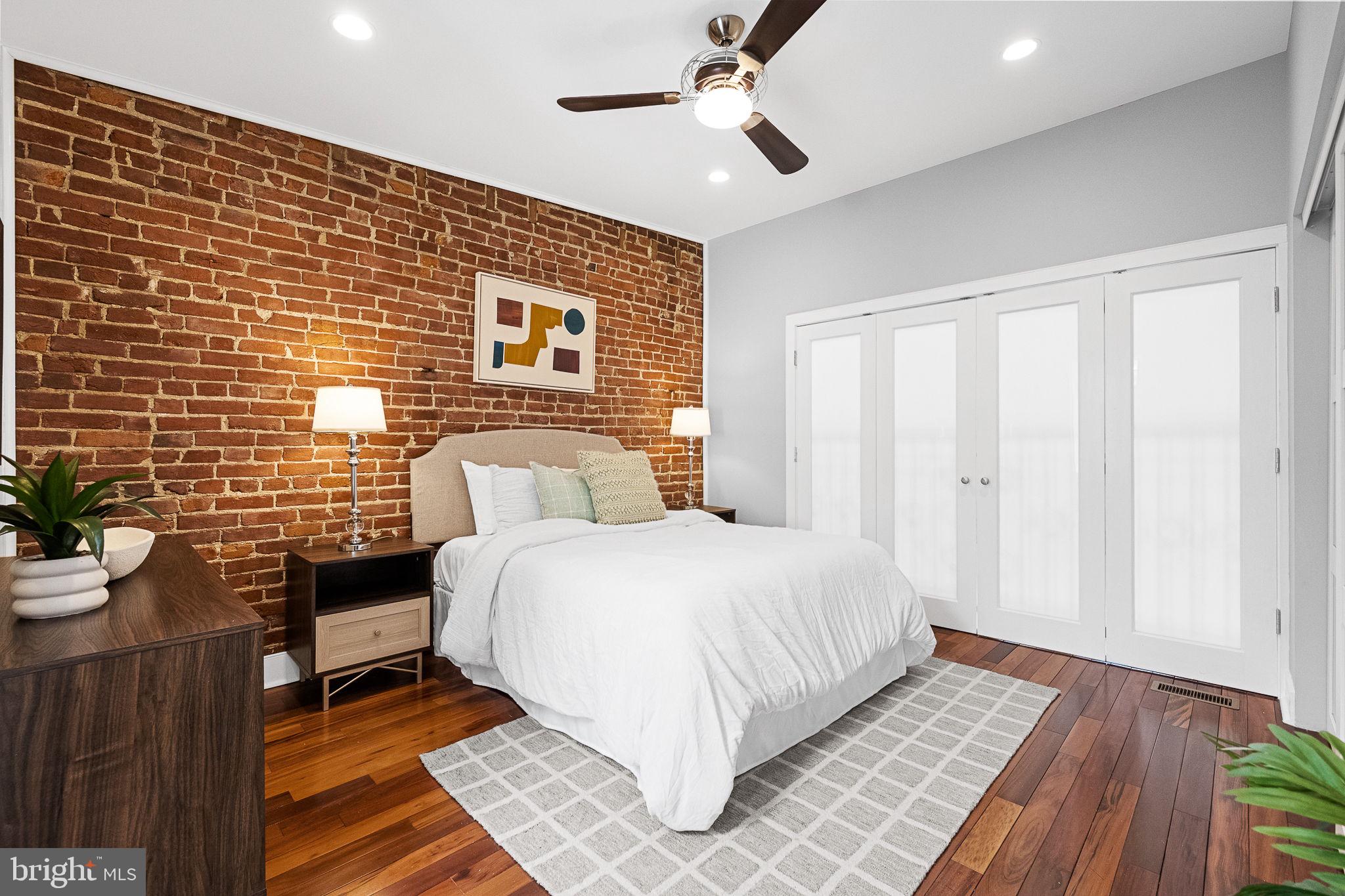 2819 11th Street Northwest, Unit 2 Washington, DC 20001 - Photo 23 of 36 a bedroom with a bed and a chandelier