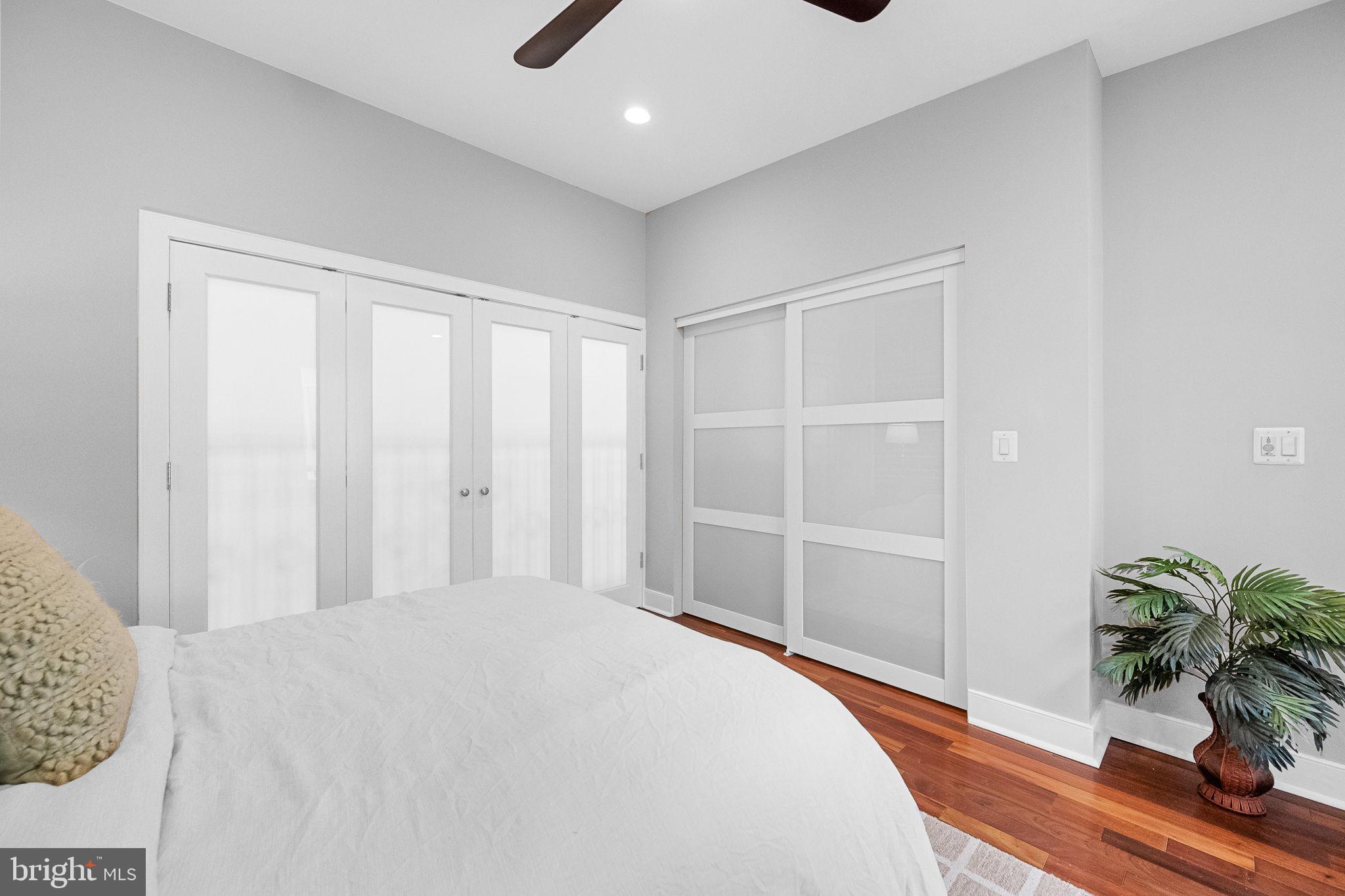 2819 11th Street Northwest, Unit 2 Washington, DC 20001 - Photo 24 of 36 a bedroom with a bed and a potted plant
