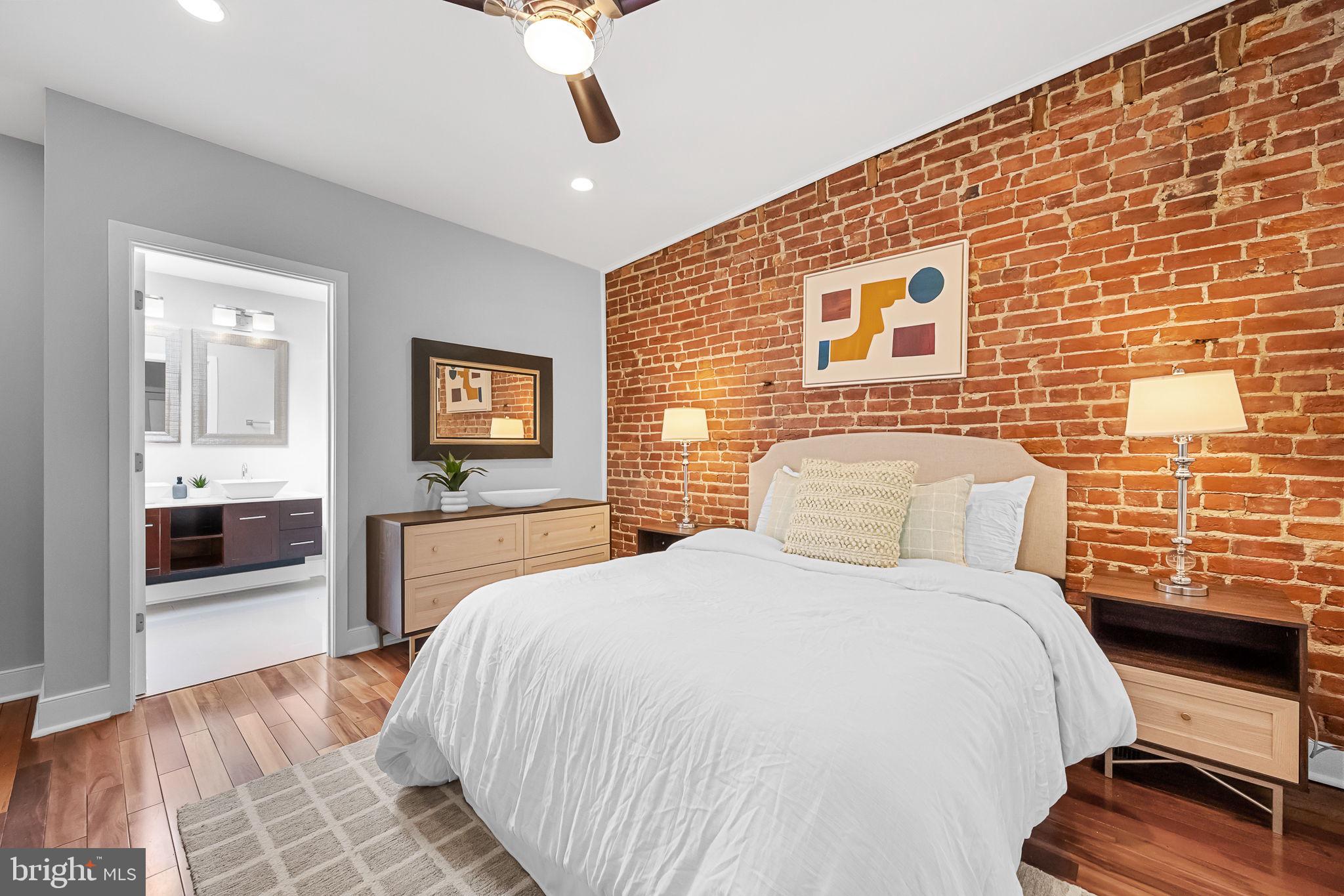 2819 11th Street Northwest, Unit 2 Washington, DC 20001 - Photo 27 of 36 a bedroom with a large bed and a tv